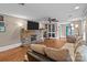 Comfortable living room featuring a stone fireplace, hardwood floors, neutral tones, and ample seating at 402 School St, Rockwell, NC 28138