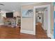 Spacious living room with hardwood floors, stone fireplace, and neutral decor, offering a cozy atmosphere at 402 School St, Rockwell, NC 28138