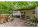 Inviting wooden deck surrounded by trees, perfect for outdoor relaxation and entertaining at 4038 Forest Brook Dr, Edgemoor, SC 29712