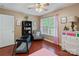 Bedroom featuring hardwood floors, a large window, and a comfortable sitting chair at 4038 Forest Brook Dr, Edgemoor, SC 29712