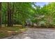 The home's front exterior showcases a stone pathway leading to a charming front porch at 4038 Forest Brook Dr, Edgemoor, SC 29712