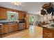Kitchen with stainless steel appliances, wood cabinets and laminate flooring at 4038 Forest Brook Dr, Edgemoor, SC 29712