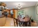 Bright kitchen and dining area with laminate floors and stainless steel appliances at 4038 Forest Brook Dr, Edgemoor, SC 29712