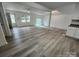 Open-concept living room featuring light-colored floors and modern ceiling fan at 409 S Martin Luther King Jr Ave, Salisbury, NC 28144