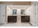 Bathroom features double vanity, dark cabinets, neutral paint, and large mirrors at 4509 Rosecliff Dr, Charlotte, NC 28277