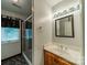 Updated bathroom features a glass enclosed shower, vanity with lighting, and modern fixtures at 4509 Rosecliff Dr, Charlotte, NC 28277