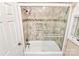 Bathroom featuring a glass shower and tub with neutral tile at 4509 Rosecliff Dr, Charlotte, NC 28277