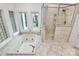 Bright bathroom featuring a jacuzzi tub, shower, and tile flooring at 4509 Rosecliff Dr, Charlotte, NC 28277