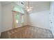 Upstairs bedroom featuring neutral carpet, vaulted ceiling, and a large window at 4509 Rosecliff Dr, Charlotte, NC 28277