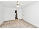 Bedroom featuring a ceiling fan, carpet, and door to an adjoining bathroom at 4509 Rosecliff Dr, Charlotte, NC 28277