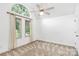 Bedroom featuring a ceiling fan, carpet, and windows for natural light at 4509 Rosecliff Dr, Charlotte, NC 28277