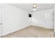 Bright bedroom with neutral carpet, ceiling fan and window letting in natural light at 4509 Rosecliff Dr, Charlotte, NC 28277