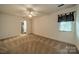 Bright bedroom has carpet flooring, ceiling fan, and natural light from the window at 4509 Rosecliff Dr, Charlotte, NC 28277