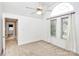 Bedroom featuring a ceiling fan, carpet, and windows for natural light at 4509 Rosecliff Dr, Charlotte, NC 28277