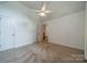 Upstairs bedroom with carpet flooring and standard closet view looking to bonus room at 4509 Rosecliff Dr, Charlotte, NC 28277