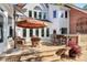 Spacious backyard patio with plenty of seating features an umbrella for shade at 4509 Rosecliff Dr, Charlotte, NC 28277