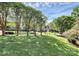 Scenic view of a well maintained front yard with mature trees and shade on the lawn at 4509 Rosecliff Dr, Charlotte, NC 28277