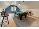 Upstairs game room featuring a billiards table, seating, and neutral carpet at 4509 Rosecliff Dr, Charlotte, NC 28277