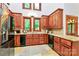 Well-lit kitchen featuring granite countertops, wood cabinets, and stainless steel appliances at 4509 Rosecliff Dr, Charlotte, NC 28277