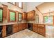 Well-appointed kitchen features wooden cabinets, granite countertops, and tiled flooring at 4509 Rosecliff Dr, Charlotte, NC 28277