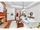 Inviting living room featuring a brick fireplace, hardwood floors, comfortable seating, and lots of natural light at 4509 Rosecliff Dr, Charlotte, NC 28277