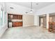 Bright living room featuring vaulted ceilings, built-in cabinets, and carpeting at 4509 Rosecliff Dr, Charlotte, NC 28277