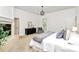 Large primary bedroom featuring a fireplace, hardwood floors, neutral colors and dark wood dresser at 4509 Rosecliff Dr, Charlotte, NC 28277