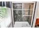 Modern walk-in shower with glass door and decorative tile work at 4509 Rosecliff Dr, Charlotte, NC 28277