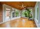 Bright sunroom with wood ceiling, hardwood floors, and large windows overlooking the backyard at 4509 Rosecliff Dr, Charlotte, NC 28277