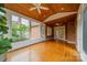 Sunroom features include brick accent wall, hardwood floors, wood ceiling and large windows at 4509 Rosecliff Dr, Charlotte, NC 28277