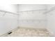 Walk-in closet with multiple shelves, tile flooring, and plenty of space at 4509 Rosecliff Dr, Charlotte, NC 28277