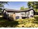 View of home with a well-maintained yard and storage sheds at 5014 Oxford School Rd, Claremont, NC 28610