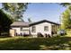 Backyard of home featuring a covered porch, grill, and storage shed at 5014 Oxford School Rd, Claremont, NC 28610