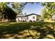 Expansive backyard featuring a well-maintained lawn and mature trees, offering ample outdoor space at 5014 Oxford School Rd, Claremont, NC 28610