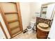 Bathroom features vanity with vessel sink, stylish tile, and wood shelving at 5014 Oxford School Rd, Claremont, NC 28610