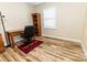 This bedroom features stylish wood-look flooring and neutral wall colors at 5014 Oxford School Rd, Claremont, NC 28610