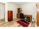 Bedroom featuring wood-look flooring, neutral walls, and wooden furniture at 5014 Oxford School Rd, Claremont, NC 28610