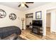 Bedroom features a decorative fireplace, closet, and TV at 5014 Oxford School Rd, Claremont, NC 28610