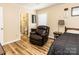 Bedroom featuring a recliner and an en-suite bathroom at 5014 Oxford School Rd, Claremont, NC 28610