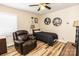 Well-lit bedroom with decorative shelves, recliner, and a comfortable bed at 5014 Oxford School Rd, Claremont, NC 28610