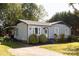 Inviting single-story home with a gray exterior, tidy landscaping, and an inviting front porch at 5014 Oxford School Rd, Claremont, NC 28610