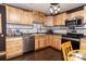 Well-lit kitchen with stainless steel appliances, bright cabinets, and black and white backsplash at 5014 Oxford School Rd, Claremont, NC 28610