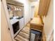 Bright laundry room features modern washer and dryer, and ample storage space with built-in cabinets and shelving at 5014 Oxford School Rd, Claremont, NC 28610