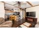 Spacious open-concept space seamlessly blending living and kitchen areas with wood accents and modern lighting at 5014 Oxford School Rd, Claremont, NC 28610