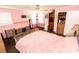Bedroom boasts lots of space, a ceiling fan, and an ample amount of natural light from the windows at 5014 Oxford School Rd, Claremont, NC 28610