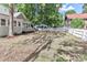 Spacious backyard featuring traditional white picket fence providing privacy at 531 Walnut St, Statesville, NC 28677
