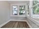 Cozy bedroom featuring bright windows and wood-look flooring at 531 Walnut St, Statesville, NC 28677