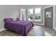 Bedroom with gray walls, three windows and a full sized bed at 531 Walnut St, Statesville, NC 28677