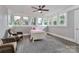 Bedroom featuring three windows, wood floors, and neutral paint at 531 Walnut St, Statesville, NC 28677