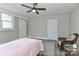 Bedroom featuring two closets, wood floors, and neutral paint at 531 Walnut St, Statesville, NC 28677